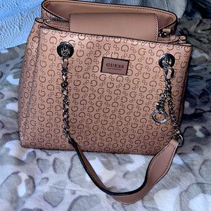 Blush pink colored Guess purse with silver hardware.